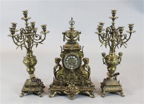 An early 20th century French bronze three piece clock garniture, 25.5in.